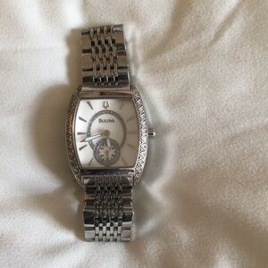 Bulova Women’s Watch -White Crystals stones on each side of the watch.